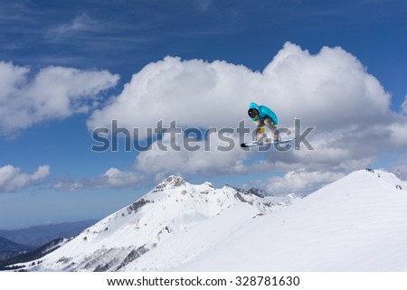 Flying snowboarder on mountains, extreme winter sport