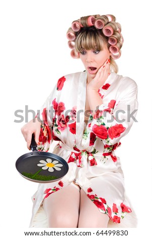 housewife with frying pan and hair curlers on a white background