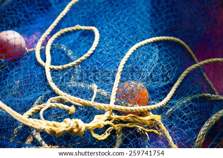 Rustic marine background with diamond mesh fish net.