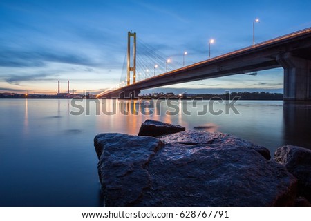 Similar – Foto Bild Gegenlichtlandschaftsbild mit Brücke, Fluss und Strommast