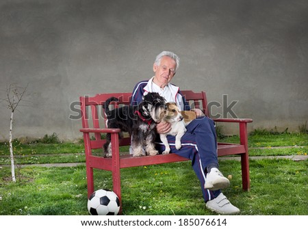 Senior man with dogs sitting on bench