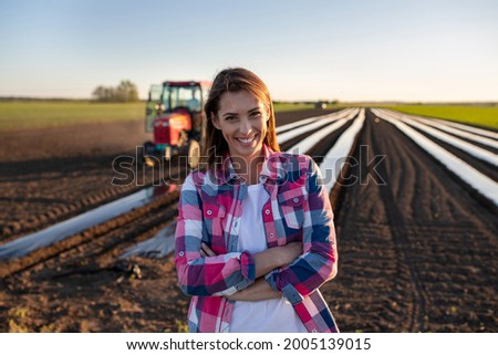 Similar – Image, Stock Photo Female farmer with tractor on olive plantation