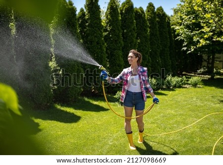 Similar – Image, Stock Photo Woman with water hose