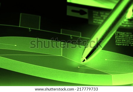 Cake diagram with pencil pointing in neon light on dark background