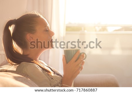 Similar – Image, Stock Photo Pensive Pretty Young Woman in a casual pose sits on a chair barefoot