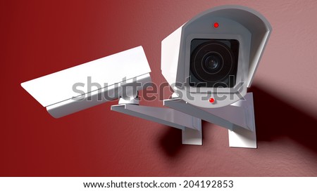 Two white wireless surveillance camera with illuminated lights mounted on an isolated red wall with copy space