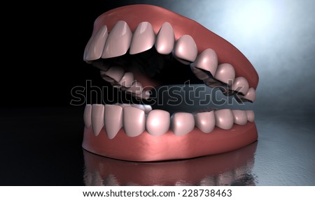 Separated upper and lower sets of human teeth set in gums on an isolated background