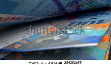 A 3D rendering of a macro close-up view showing the detail in between two separated swiss franc banknotes