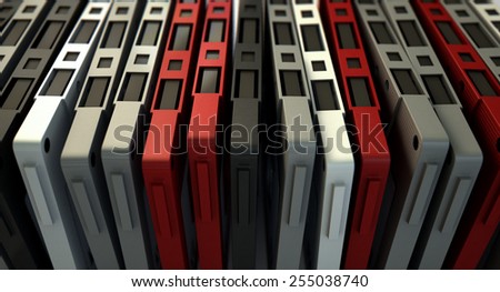 A close up view of a collection of vintage audio cassette tape lined up in a row on an isolated white background