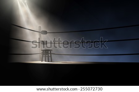 A dramatic view of the corner of an old vintage boxing ring with an empty stool spotlit by a single spotlight on an isolated dark background