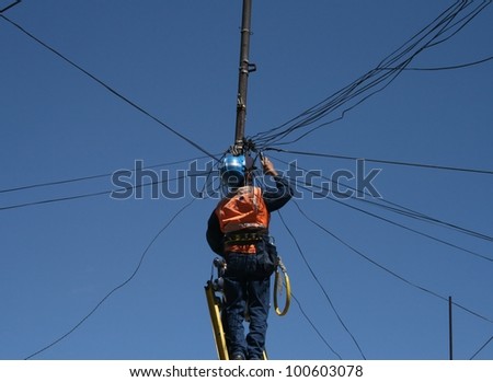 Man  at work with electricity cables