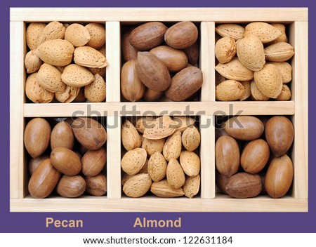pecan and almond nuts in wooden box