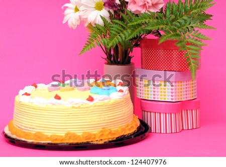 concept of cake, flowers and gifts for birthday party