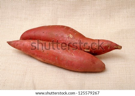 two sweet potato on burlap