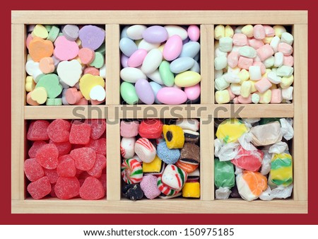 many kinds of candies in wooden box
