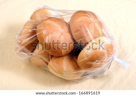 round bread buns in plastic bag for breakfast