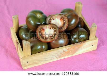 brown tomato in crate on table