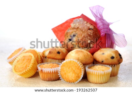 big and mini muffins on table