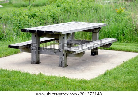 empty rusted bench and table in park