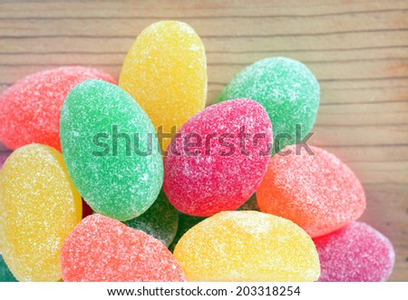 colorful gummy candy on rustic table
