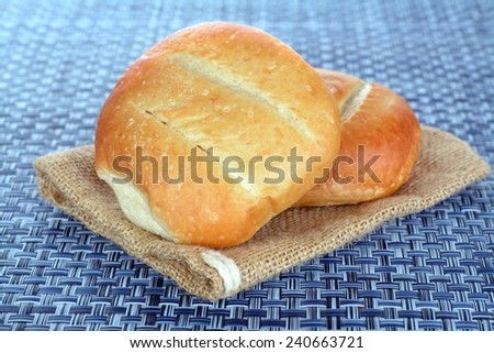 three bolillo Mexican bread on the table for breakfast