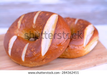 two pretzel ring bun on the table