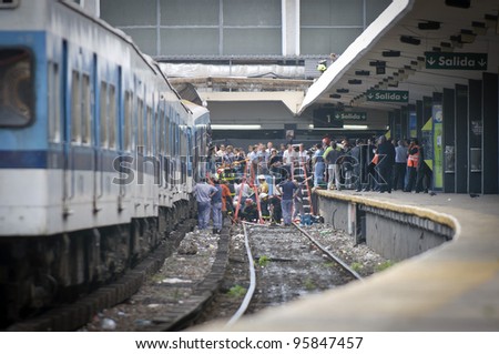 BUENOS AIRES, ARGENTINA - FEB 22: Rescuers work on the site a the train crash at Once\'s train station in Buenos Aires on February 22, 2012.