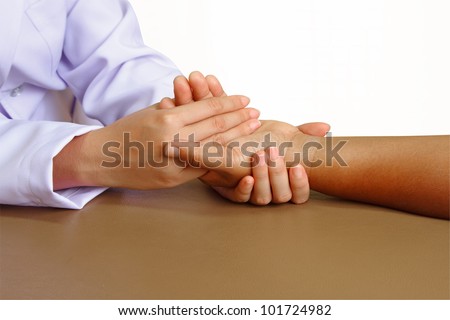 doctor or physical therapist giving exercise hand  in a health center