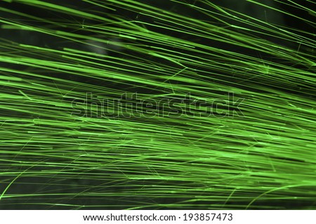 Glowing flow of sparks in the dark,Sparks background