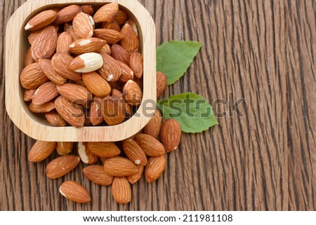almond seed on wooden bowl