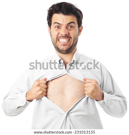 young man acting like a super hero and tearing his shirt off on
