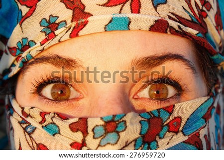 young arab woman in hijab with sexy eyes. Rooftop terrace view