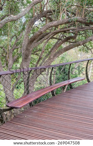 CAPE TOWN, SOUTH AFRICA - DECEMBER 9, 2014: Bench on the Kirstenbosch Tree Canopy Walkway called the Boomslang (Tree Snake), winding for 130 meters like a snake 12 meters above the ground
