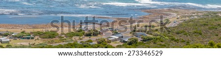 CAPE TOWN, SOUTH AFRICA - DECEMBER 12, 2014:  Panorama of the beach area south of the Slangkop Lighthouse at Kommetjie