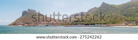 CAPE TOWN, SOUTH AFRICA - DECEMBER 12, 2014:  Panorama of Hout Bay as seen across the bay from the bronze leopard  sculpture