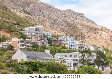 CAPE TOWN, SOUTH AFRICA - DECEMBER 20, 2014: Luxury holiday homes and lodges in the shade of the Hottentots-Holland Mountains below the Steenbras Dam pump station in Gordons Bay