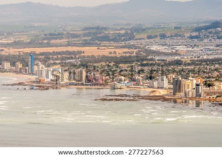 CAPE TOWN, SOUTH AFRICA - DECEMBER 20, 2014: The Strand  and Somerset West as seen across the sea from the viewpoint at the Steenbras Dam pump station