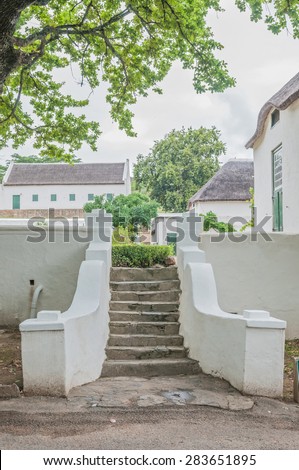 SWELLENDAM, SOUTH AFRICA - DECEMBER 26, 2014: Steps leading from the street to the historic  Drosdy, built by the Dutch East India Company in 1747