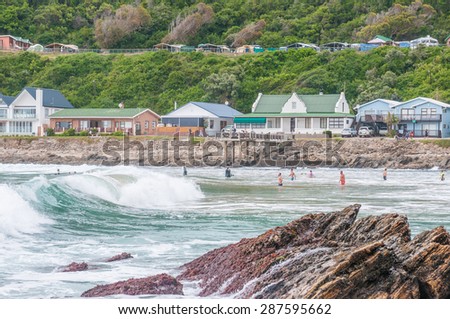 GEORGE, SOUTH AFRICA - JANUARY 4, 2015: Unidentified people, holiday homes and a caravan park at Victoria Bay, South Africa