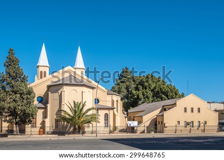 BLOEMFONTEIN, SOUTH AFRICA - JULY 19, 2015: The twin-spired Dutch Reformed Church in Bloemfontein was consecrated on 7 May 1880. The church hall is to the right