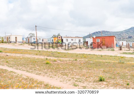 GARIES, SOUTH AFRICA - AUGUST 13, 2015: A street scene with wall art in Garies, a small town in the Namaqualand region of the Northern Cape