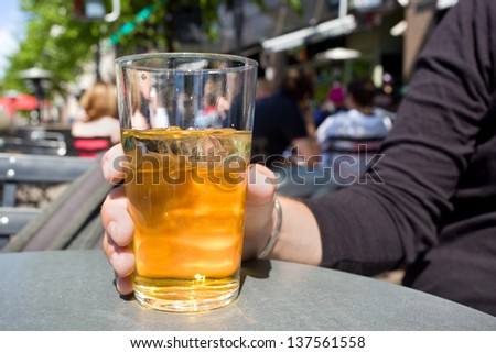 Man drinking cider in terrace