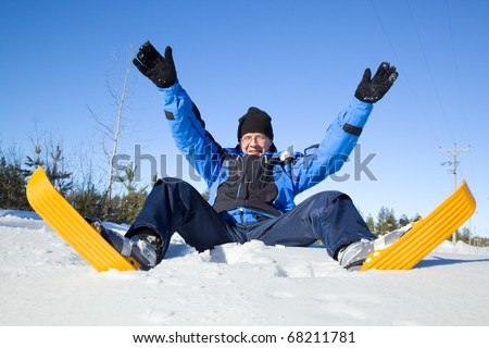 Middle-aged man falling to snow