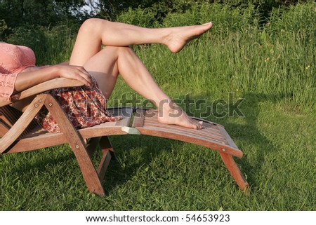 Woman  legs  enjoying  sunny day outdoors
