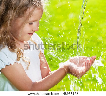 Stream Of Clean Water Pouring Into Children'S Hands. Child Play With ...