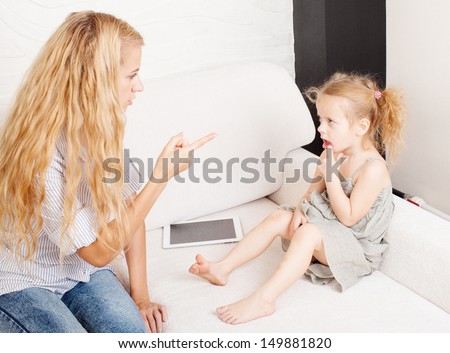 Mother scolding baby. Parent upbringing little child