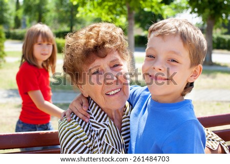 Grandmother with grandchild. Old woman with grandson