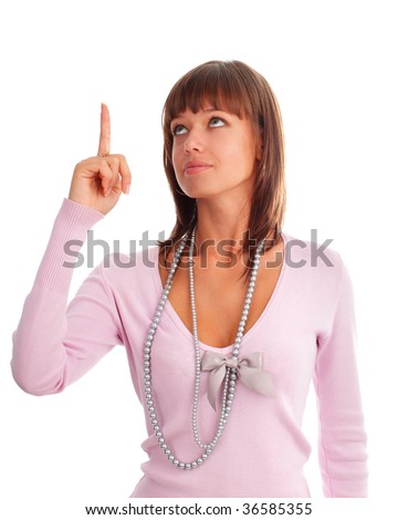 Happy young woman shows an index finger upwards