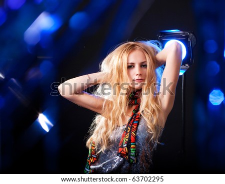 Beautiful woman dancing in a disco