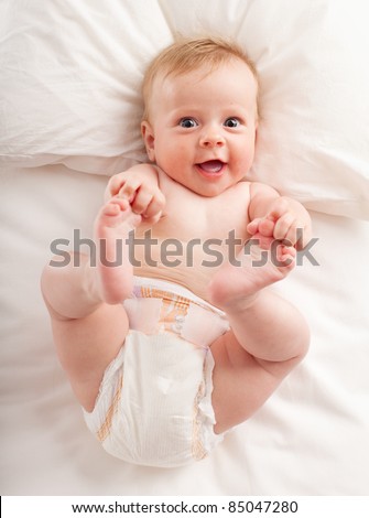 Happy baby in the bed